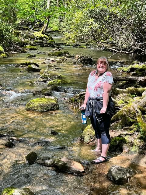 Cindy Howard near a Tennessee mountain stream