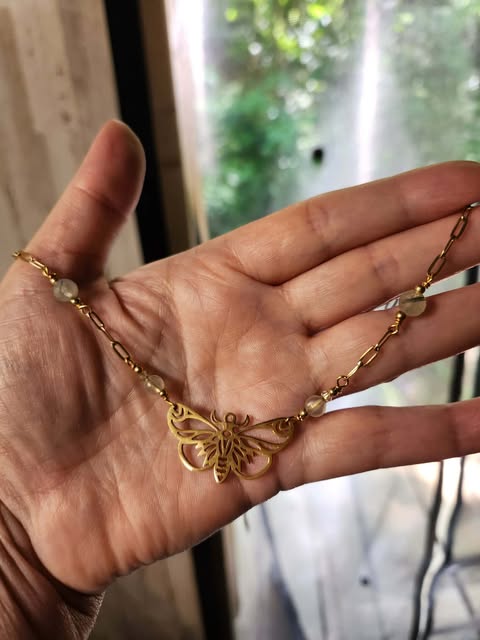 Brass butterfly necklace with rutilated quartz
